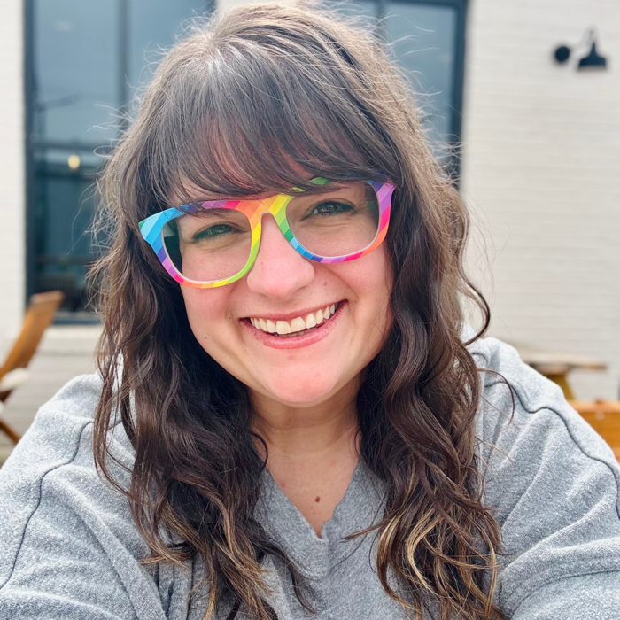 Rebekah Edwards, wearing the rainbow glasses